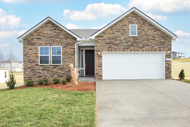 view of front of property with a garage and a front yard