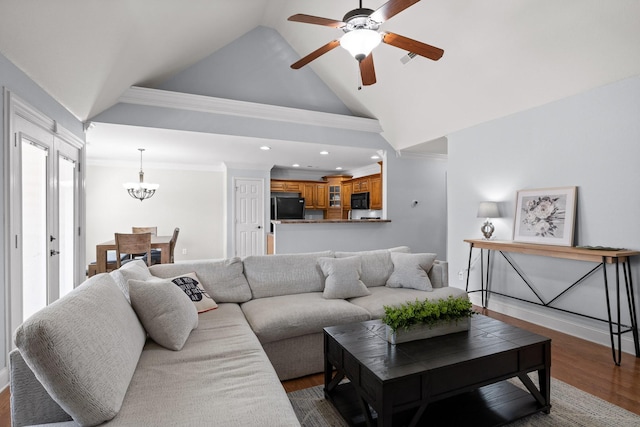 living room featuring crown molding, dark wood-type flooring, high vaulted ceiling, and ceiling fan with notable chandelier