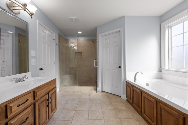 bathroom featuring vanity, tile patterned floors, and shower with separate bathtub