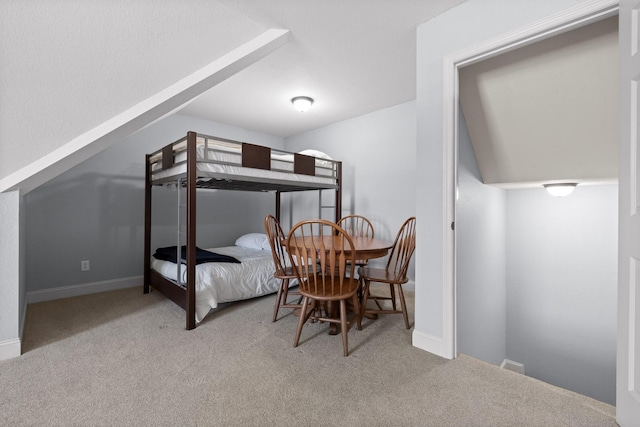 bedroom featuring light carpet