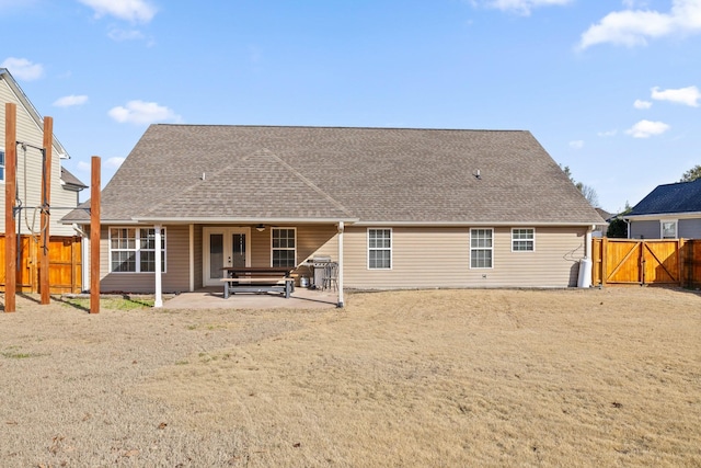 rear view of property featuring a patio area