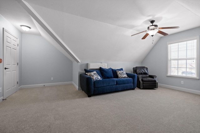 interior space featuring lofted ceiling, light colored carpet, and ceiling fan