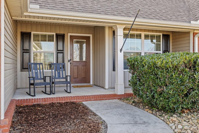 property entrance featuring a porch