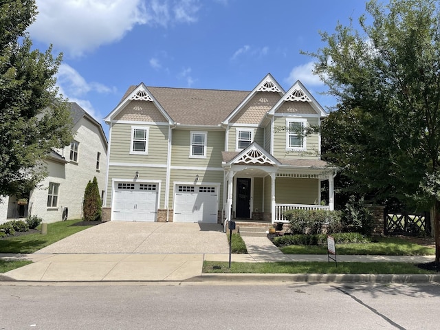 view of front facade featuring a garage and a porch