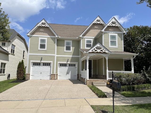 view of front of property featuring a garage and covered porch