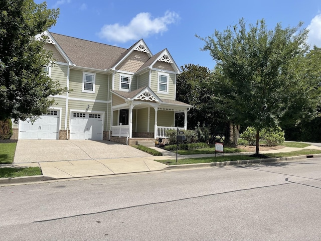 view of front of home featuring a garage and covered porch