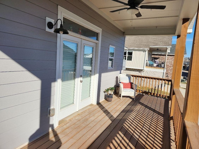 deck with french doors and ceiling fan