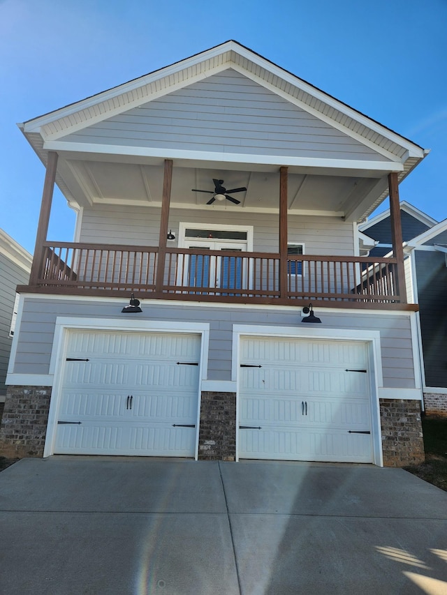 view of front facade featuring a garage and a balcony