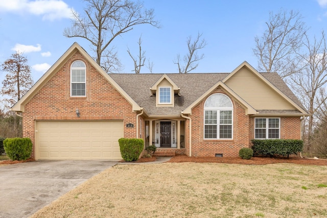 view of front of property with a garage and a front lawn