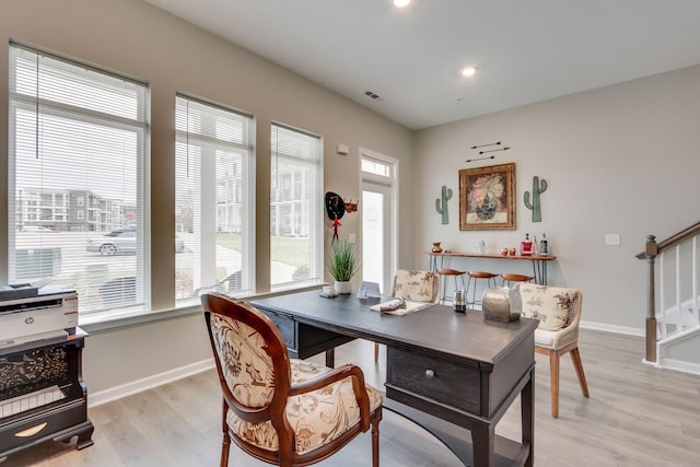 office area with light hardwood / wood-style floors