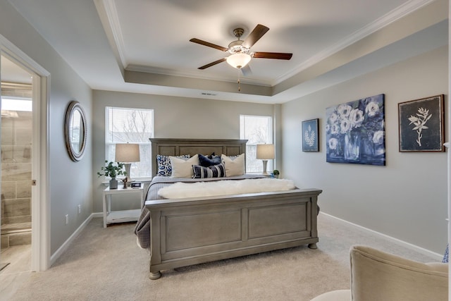 bedroom with multiple windows, ornamental molding, and a raised ceiling