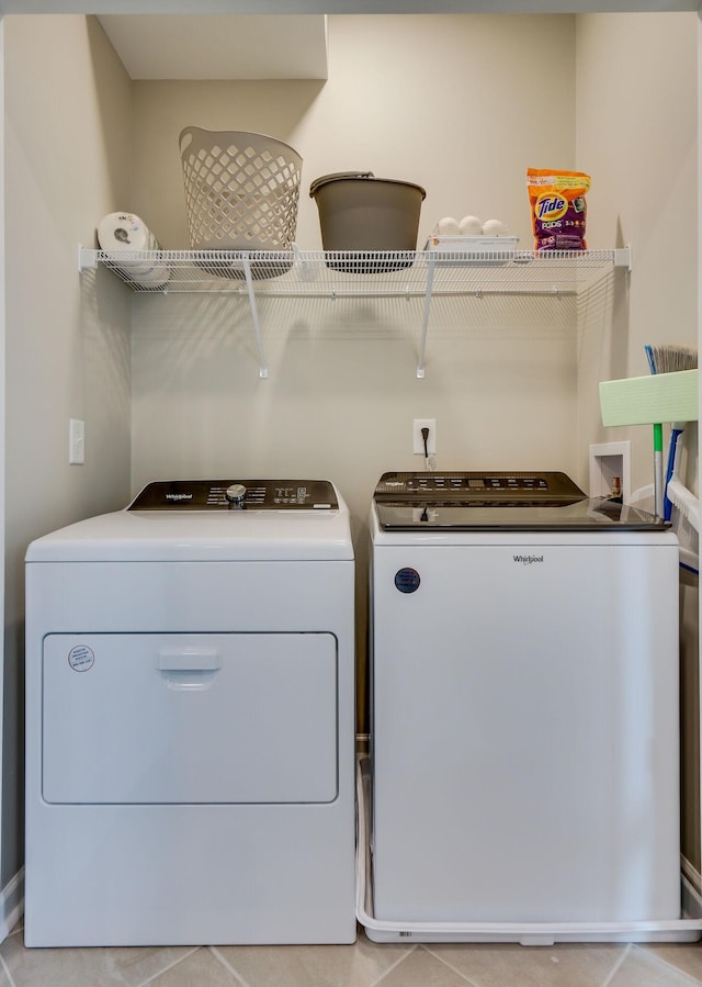 washroom with washing machine and clothes dryer