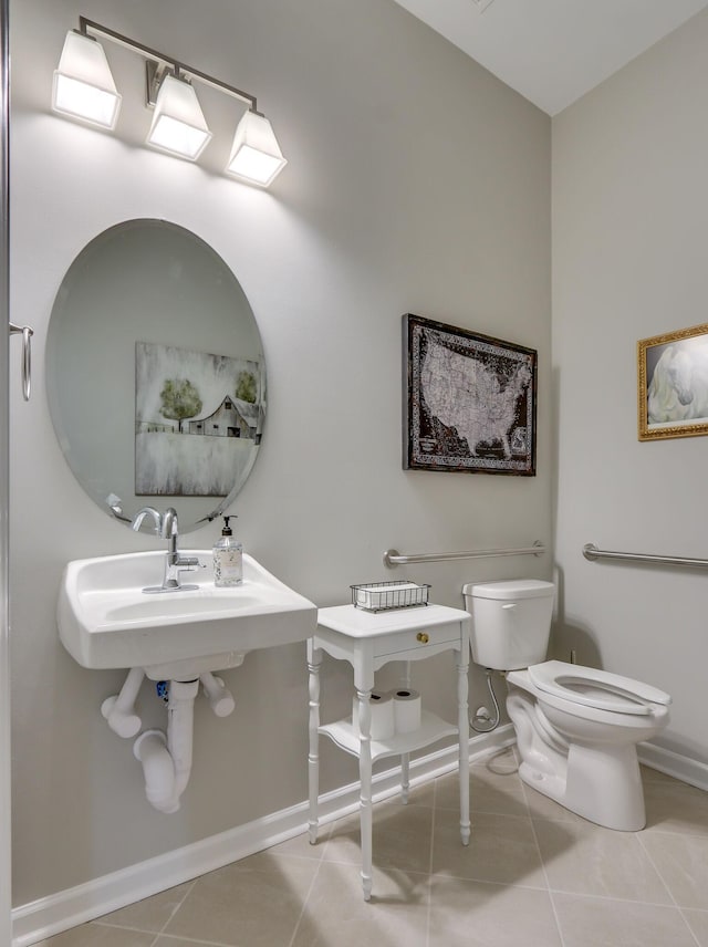 bathroom with tile patterned floors and toilet