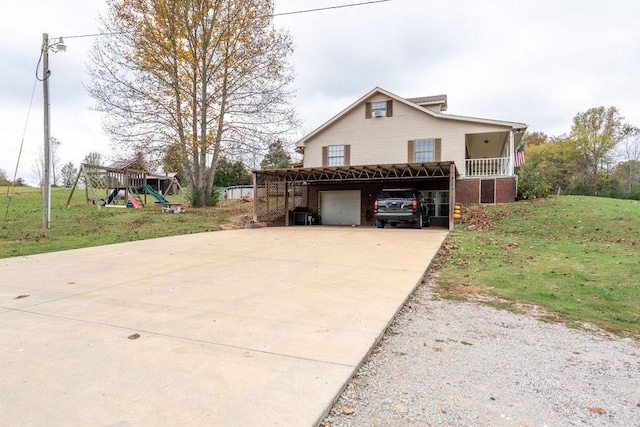 view of front facade featuring a porch, a playground, and a front yard