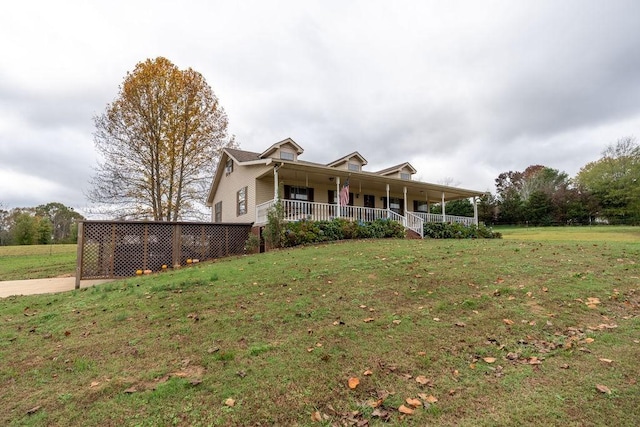 view of front of home with a front yard and a porch