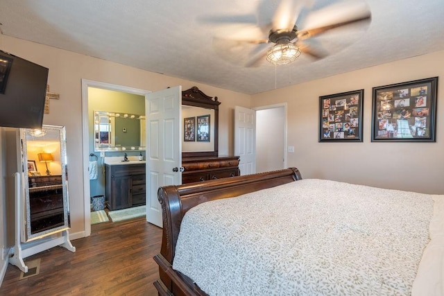 bedroom featuring dark wood-type flooring, connected bathroom, and ceiling fan