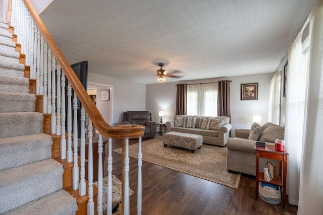 living room featuring hardwood / wood-style flooring and ceiling fan