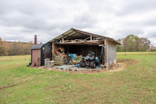 view of outbuilding featuring a yard