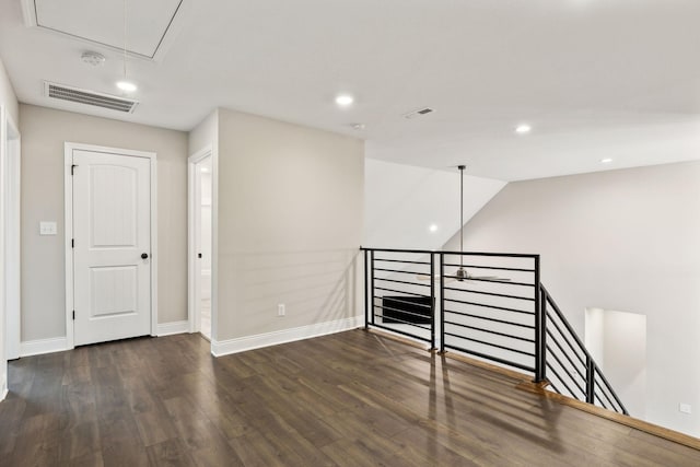 empty room with dark hardwood / wood-style floors