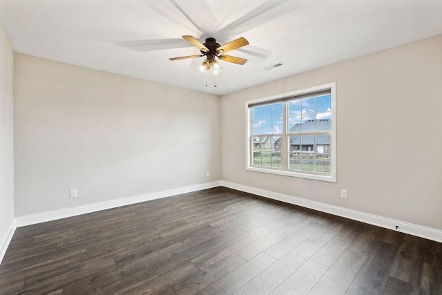 unfurnished room featuring dark hardwood / wood-style floors and ceiling fan