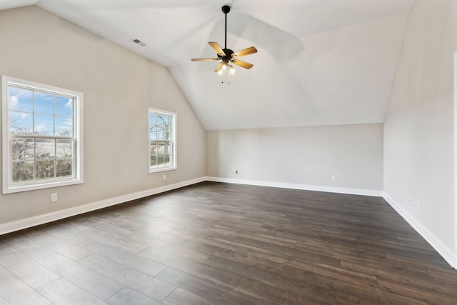 additional living space featuring vaulted ceiling, ceiling fan, and dark hardwood / wood-style flooring