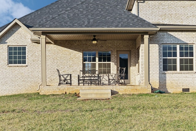 back of property featuring a lawn