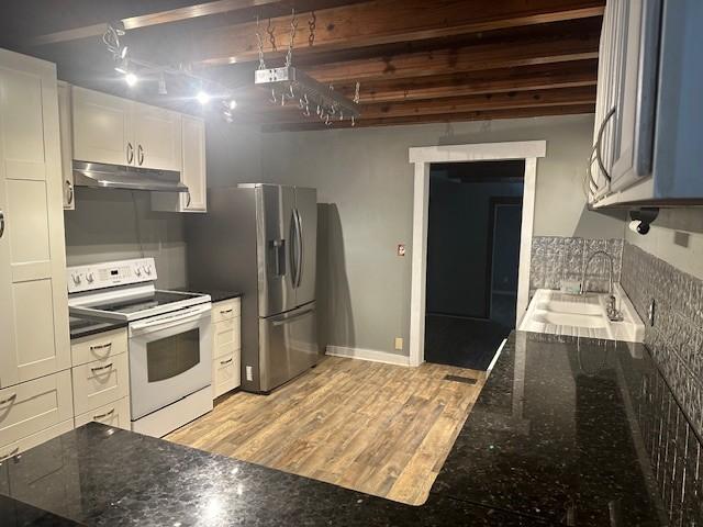 275 Patricia Cir, Indian Mound, TN 37079 - kitchen with sink, white electric range, white cabinetry, dark stone countertops, and stainless steel fridge with ice dispenser