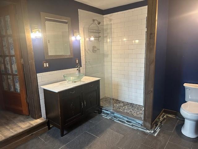 275 Patricia Cir, Indian Mound, TN 37079 - bathroom with vanity, tiled shower, and toilet