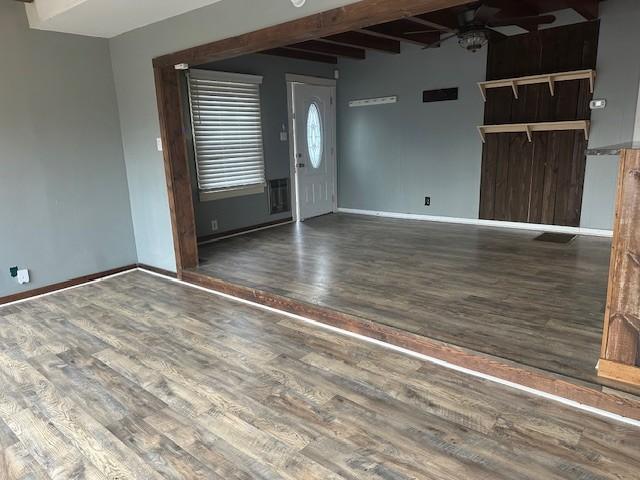 275 Patricia Cir, Indian Mound, TN 37079 - spare room with beamed ceiling, ceiling fan, and dark hardwood / wood-style flooring