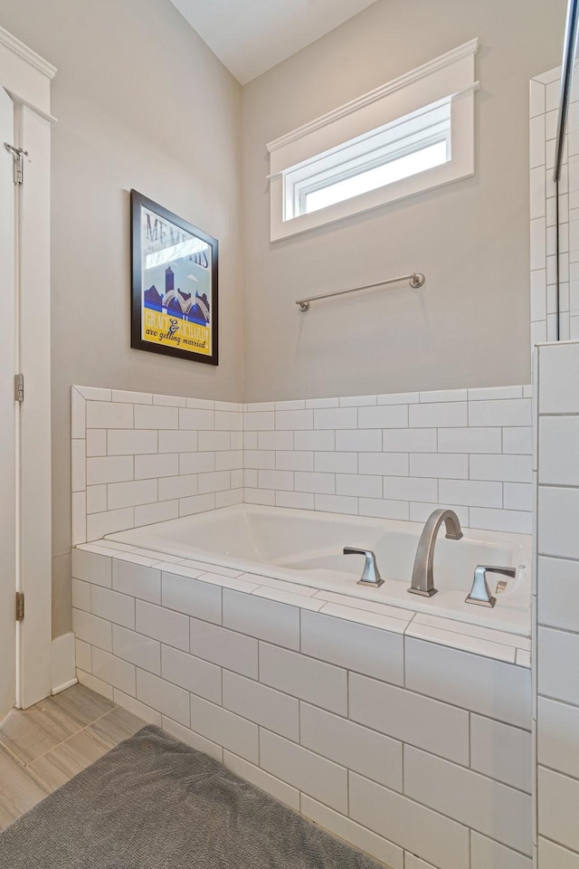 bathroom featuring tiled bath