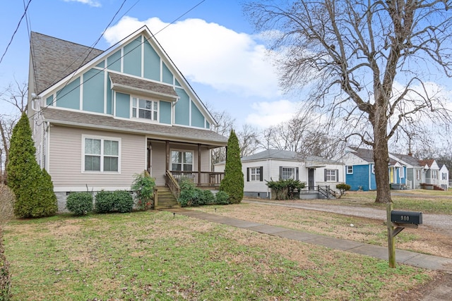 view of front of home with a front lawn and covered porch