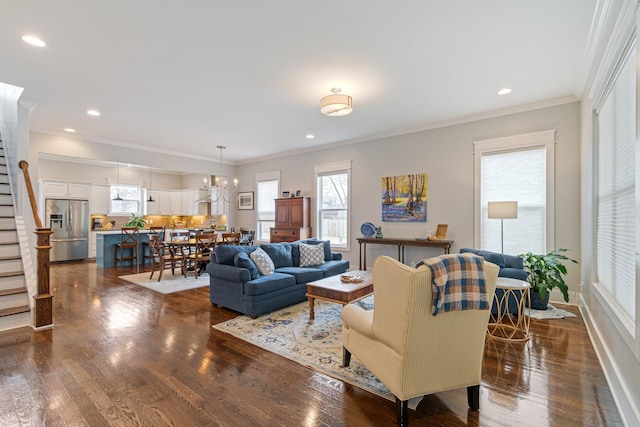 living room with crown molding and dark wood-type flooring