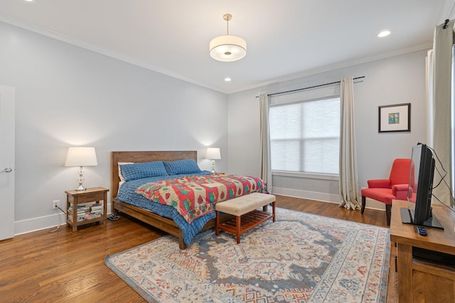 bedroom with wood-type flooring and ornamental molding