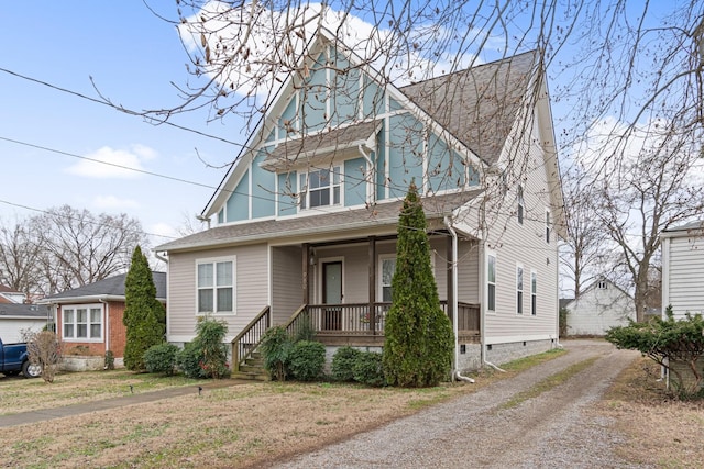 view of front of property with a porch and a front yard