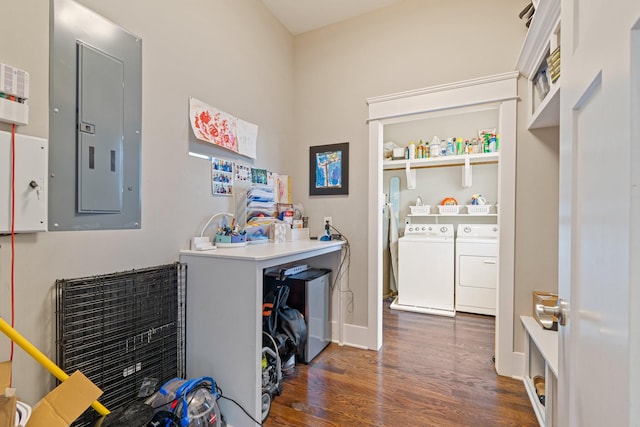 laundry room with washing machine and clothes dryer, dark hardwood / wood-style floors, and electric panel