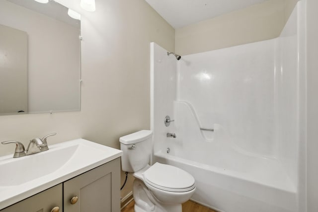 full bathroom with vanity, shower / bathtub combination, and toilet