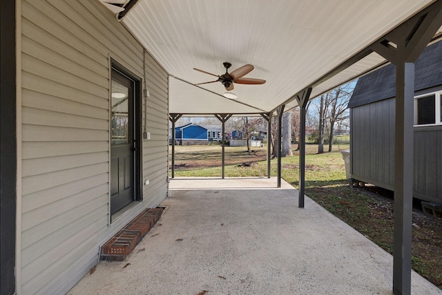 view of patio featuring ceiling fan