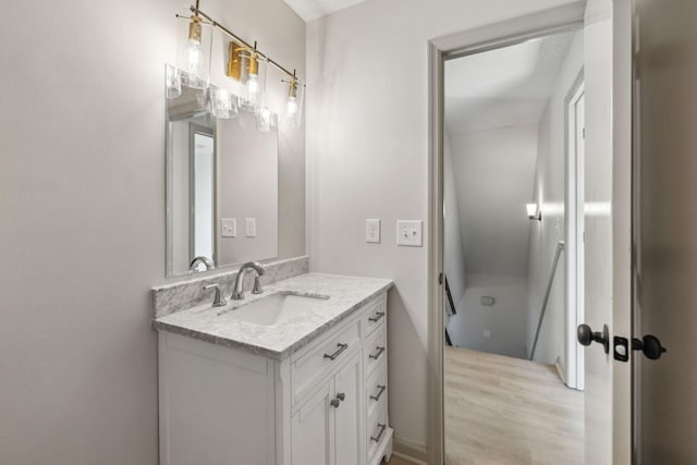 bathroom with vanity and hardwood / wood-style flooring