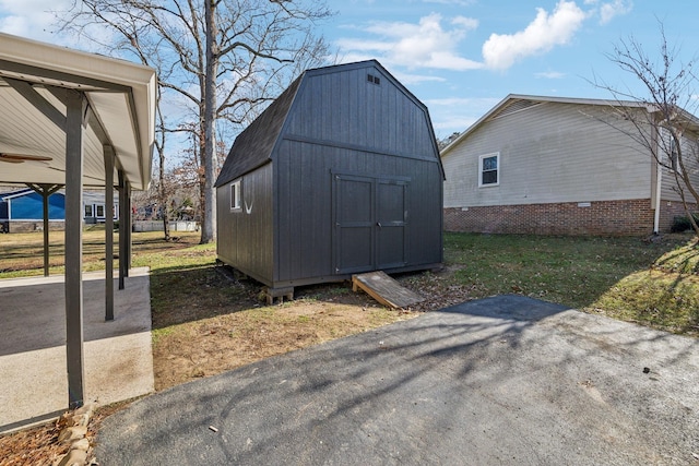 view of outbuilding featuring a lawn