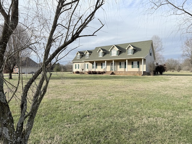 cape cod home with a front lawn and a porch