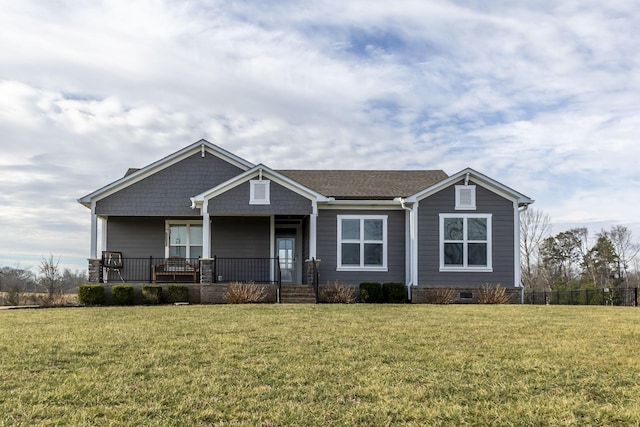 view of front of house with a porch and a front lawn