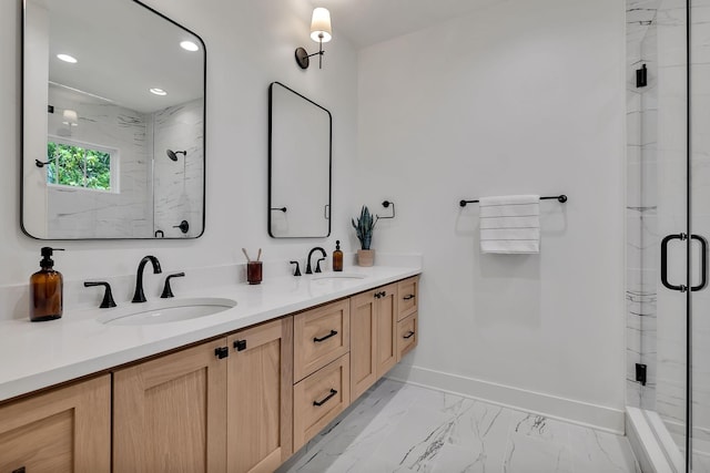 bathroom with vanity and a shower with shower door