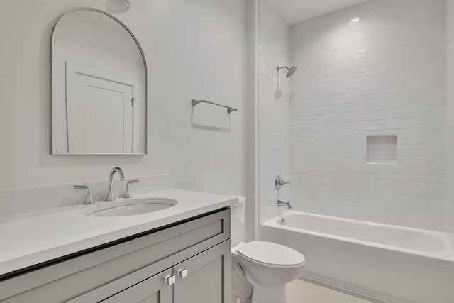 full bathroom featuring vanity, toilet, and tiled shower / bath combo