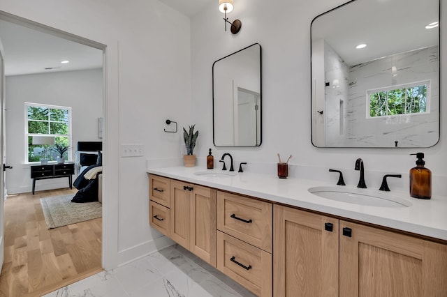 bathroom with vanity and walk in shower