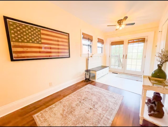 doorway to outside featuring dark hardwood / wood-style flooring, french doors, and ceiling fan