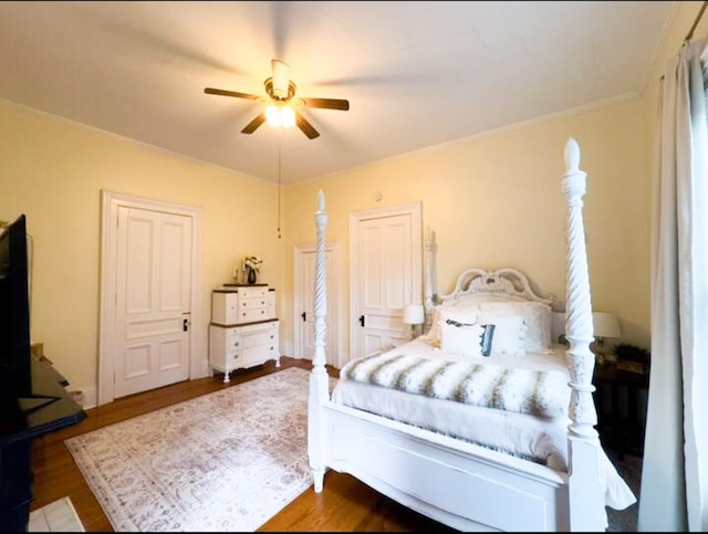 bedroom featuring dark wood-type flooring and ceiling fan