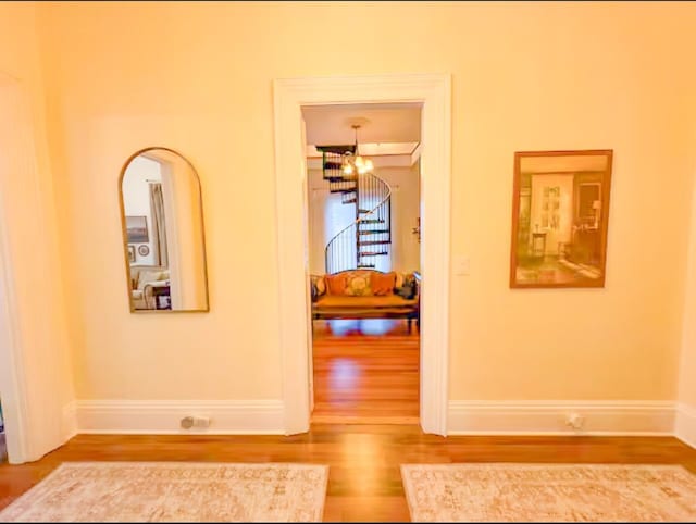 corridor with wood-type flooring