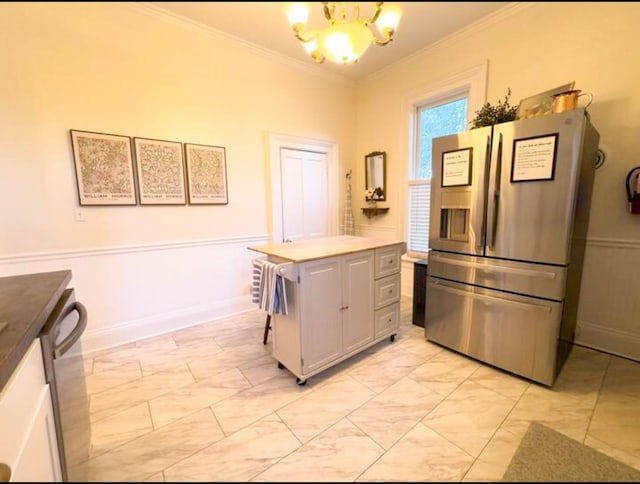 kitchen with ornamental molding, gray cabinets, stainless steel fridge with ice dispenser, and a notable chandelier