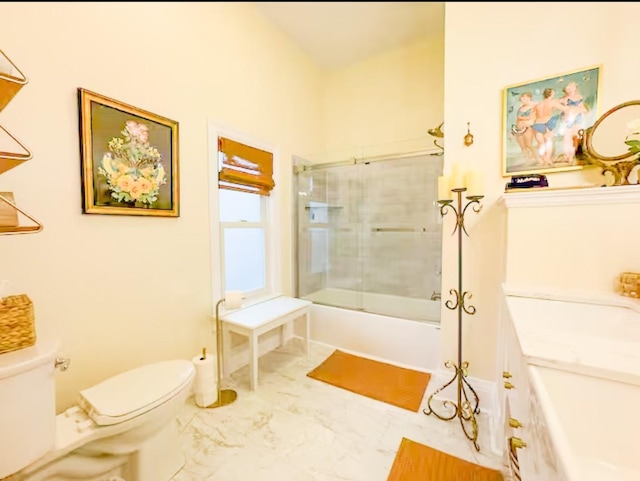 full bathroom featuring enclosed tub / shower combo, vanity, and toilet