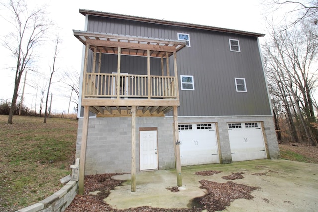 back of property with a garage